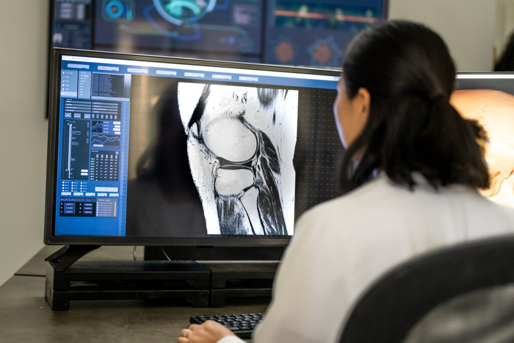 female radiologist analysing the mri image on her monitor