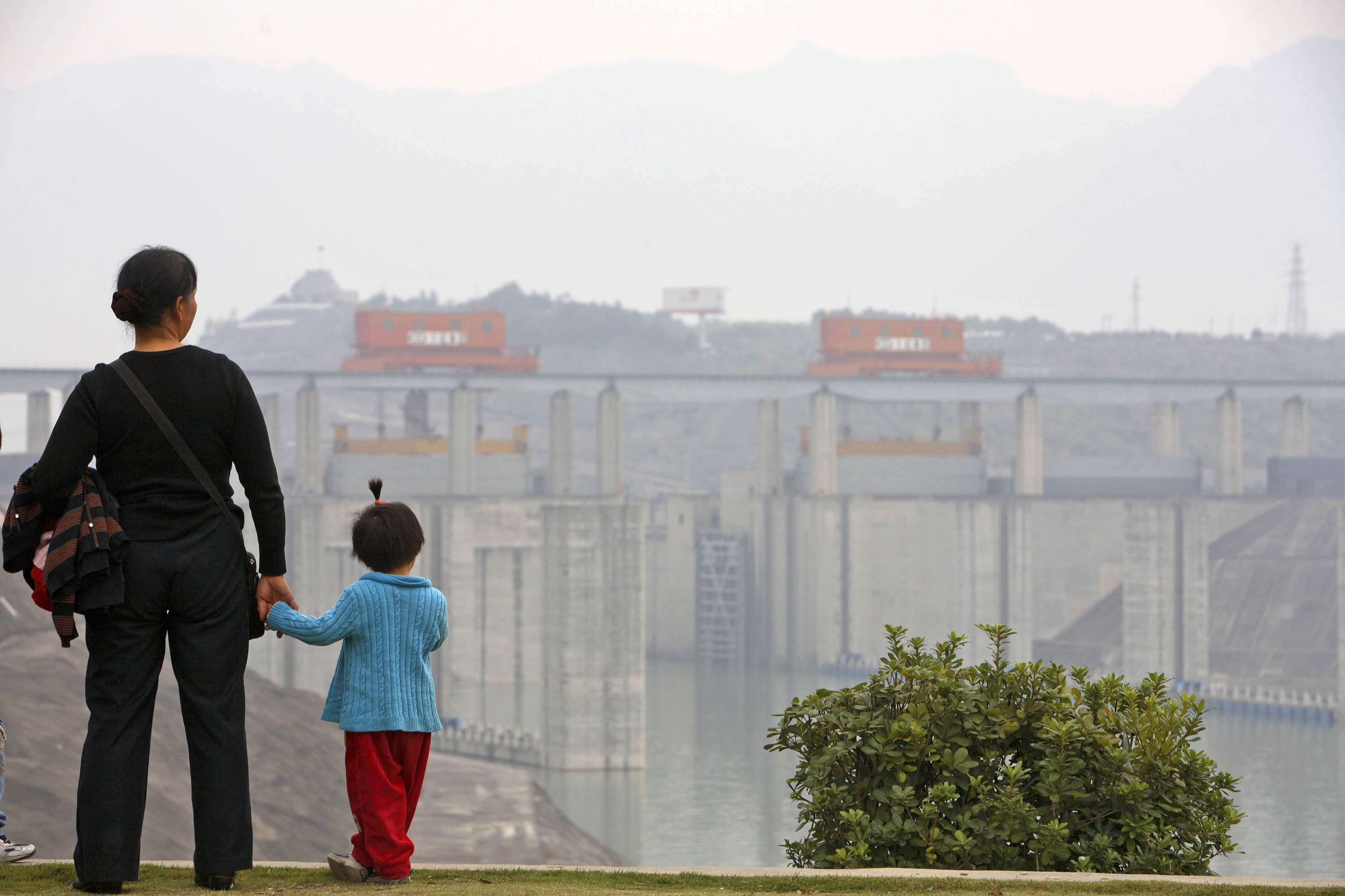 Visitors view&nbsp;the shipping locks of China’s Three Gorges Dam, where water storage is up about 25% from the previous year.