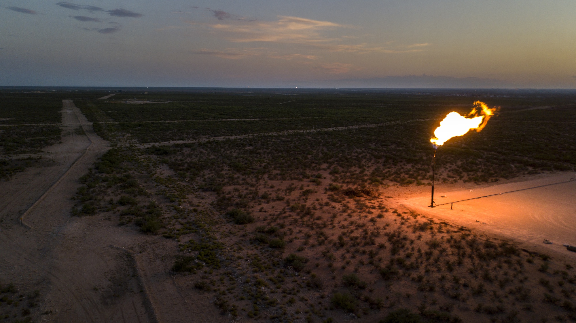 A gas flare&nbsp;above a field near Mentone, Texas.