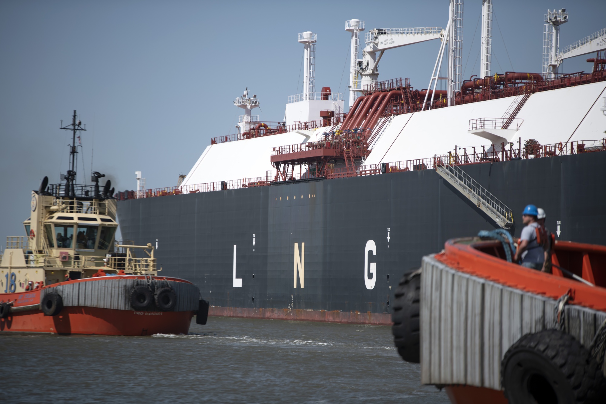 Tugs prepare to pull out an LNG tanker&nbsp;at the Cheniere Sabine Pass&nbsp;facility in&nbsp;Louisiana.