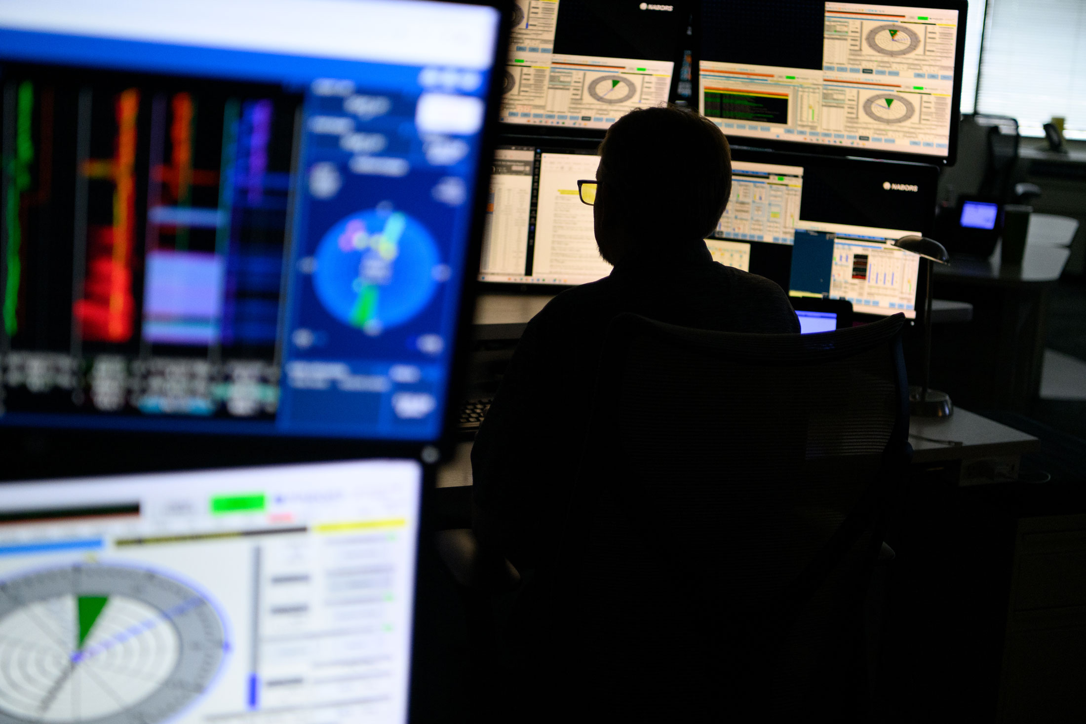 Chris Wagner, a wellbore placement specialist, works remotely to support the automation of drilling operations in North Dakota from the Nabors Industries control room in Houston.