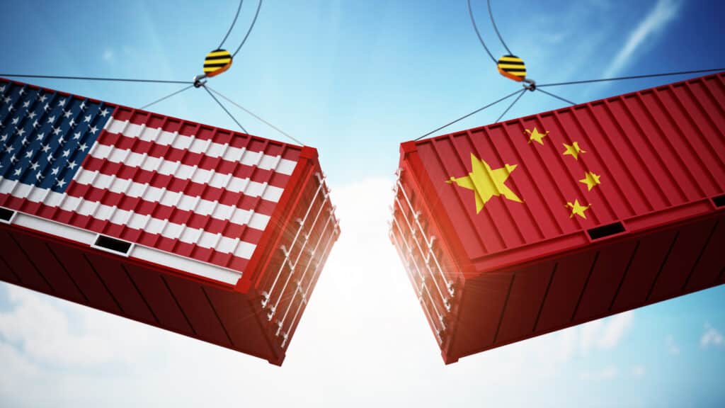 China Tariffs. Trade wars concept with American and Chinese flag textured cargo containers clashing. 3D illustration